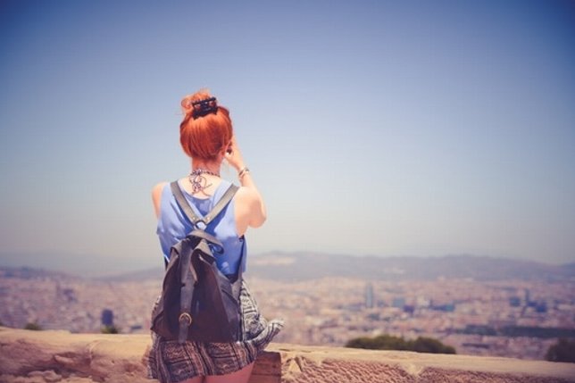 city-woman-view-blue-sky-medium